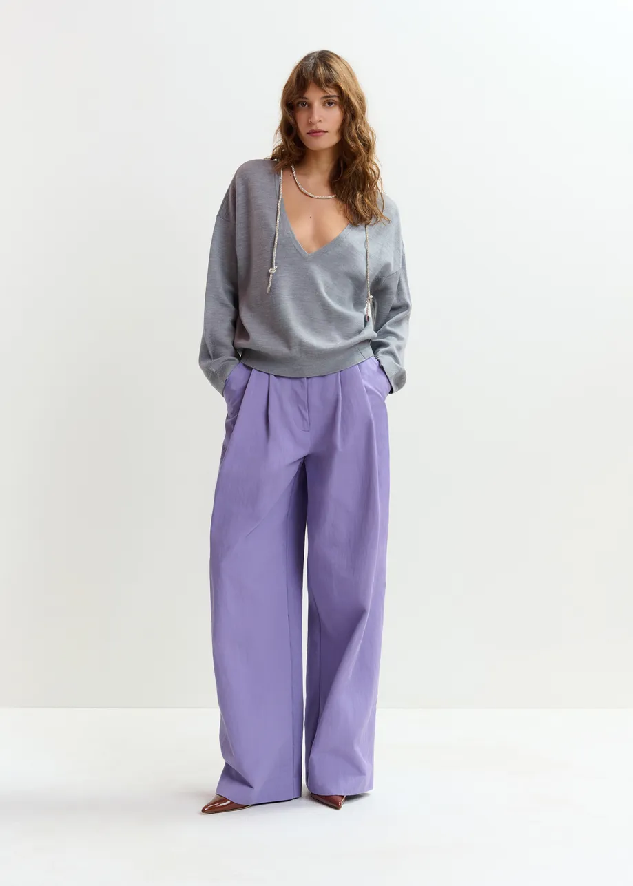 Grijze trui met open rug en siertouw