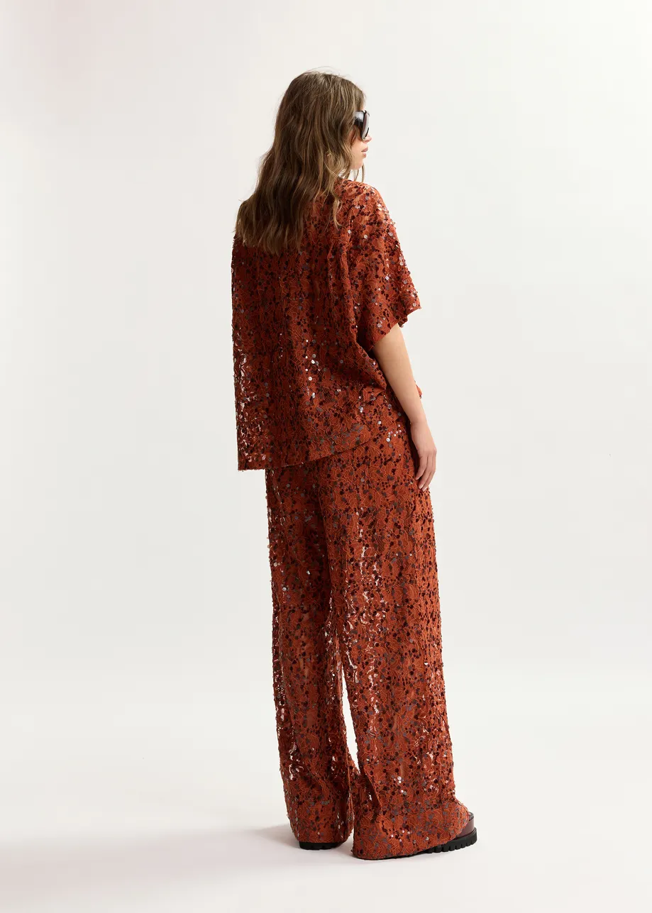 Pantaloni a gamba larga con paillettes color ruggine