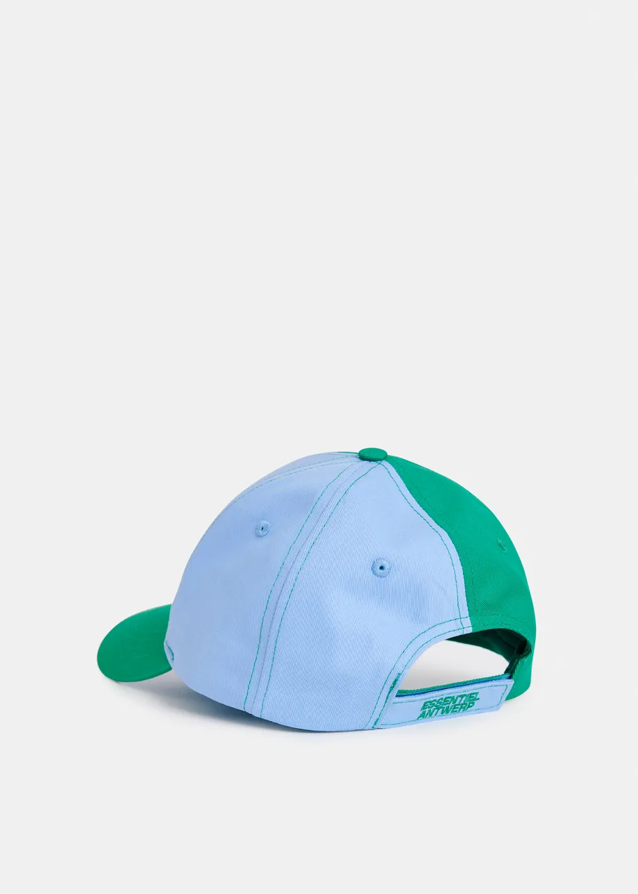 Light blue and green two-tone cotton cap with yellow patch