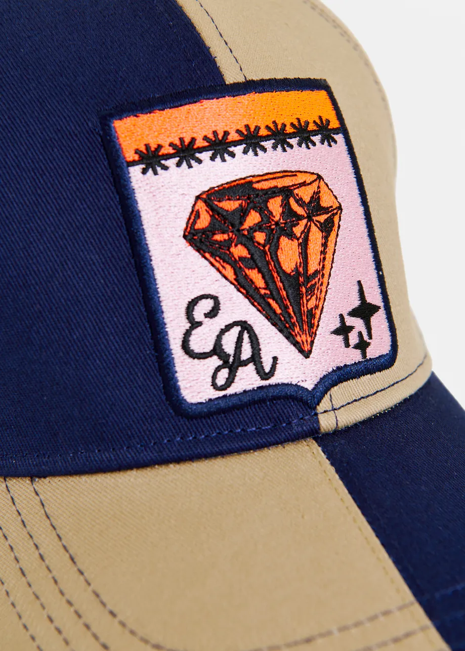 Brown and navy two-tone cotton cap with pink and orange patch