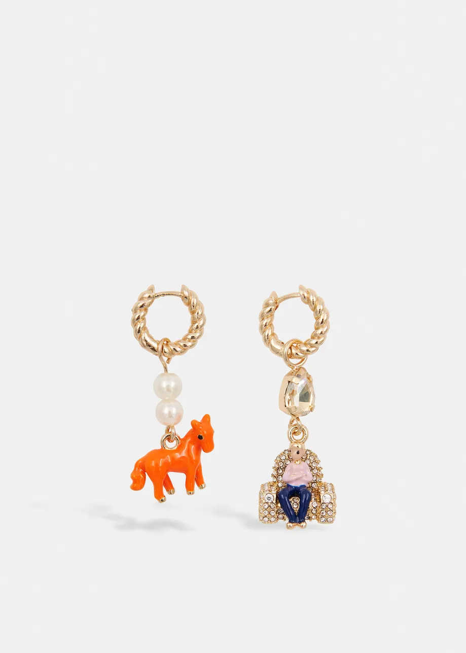 Gold hoop earrings with orange horse and pink and navy boy on a chair pendant
