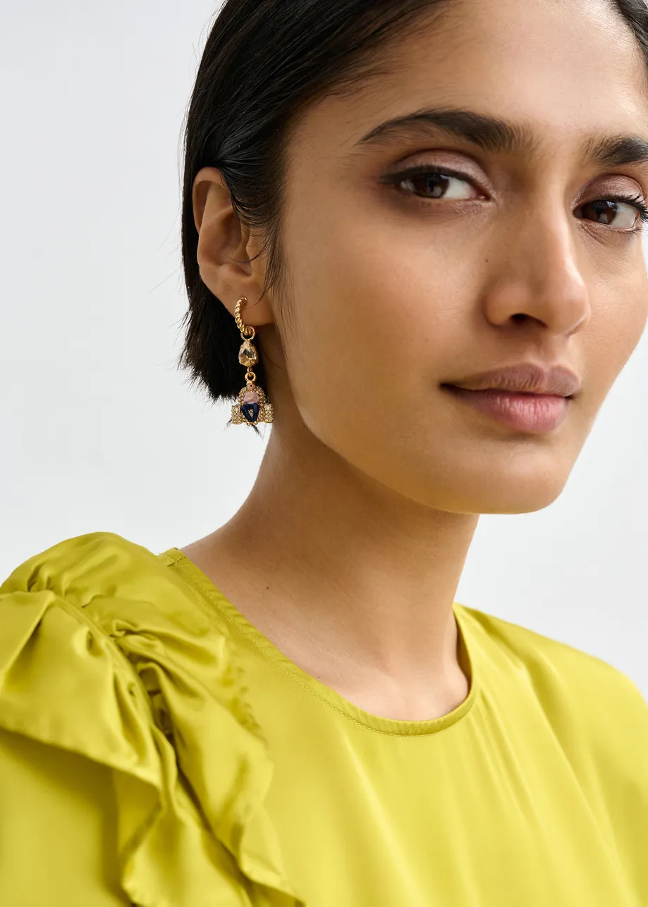 Gold hoop earrings with orange horse and pink and navy boy on a chair pendant