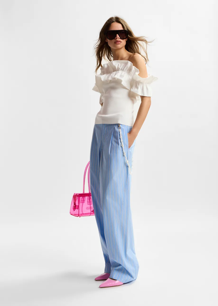 Light blue and white tapered-leg cotton pants with detachable pearl belt