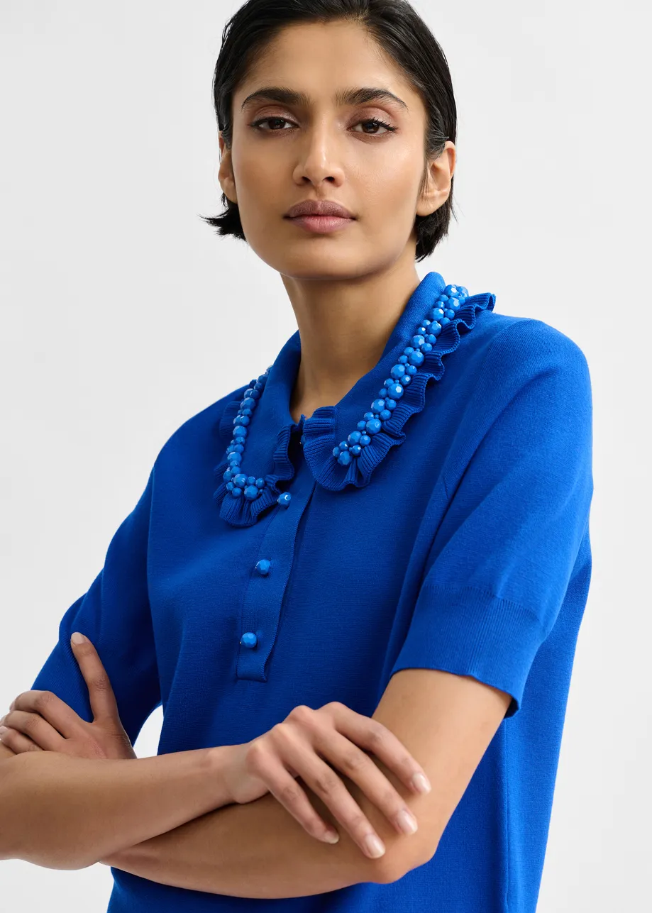 Blue ruffle fine-knit polo top with bead embellishments