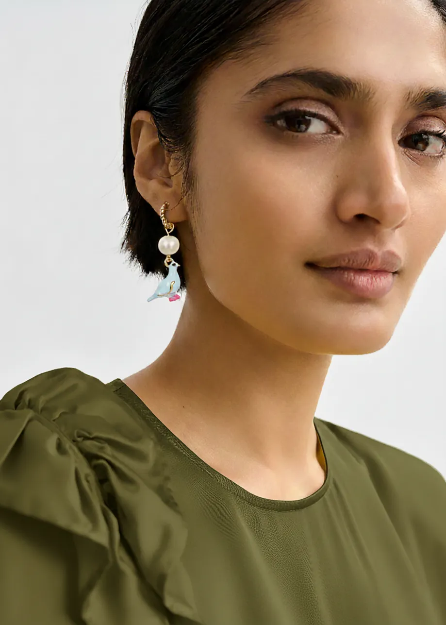 Gold hoop earrings with blue bird and yellow lips pendant