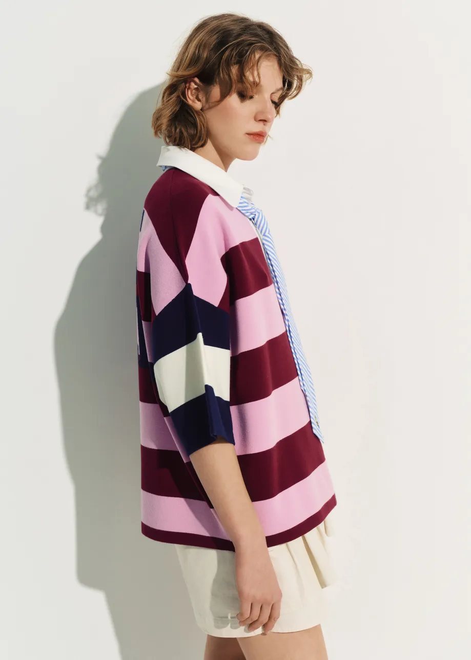 Pink and burgundy striped polo sweater with Peanuts™ patch and text