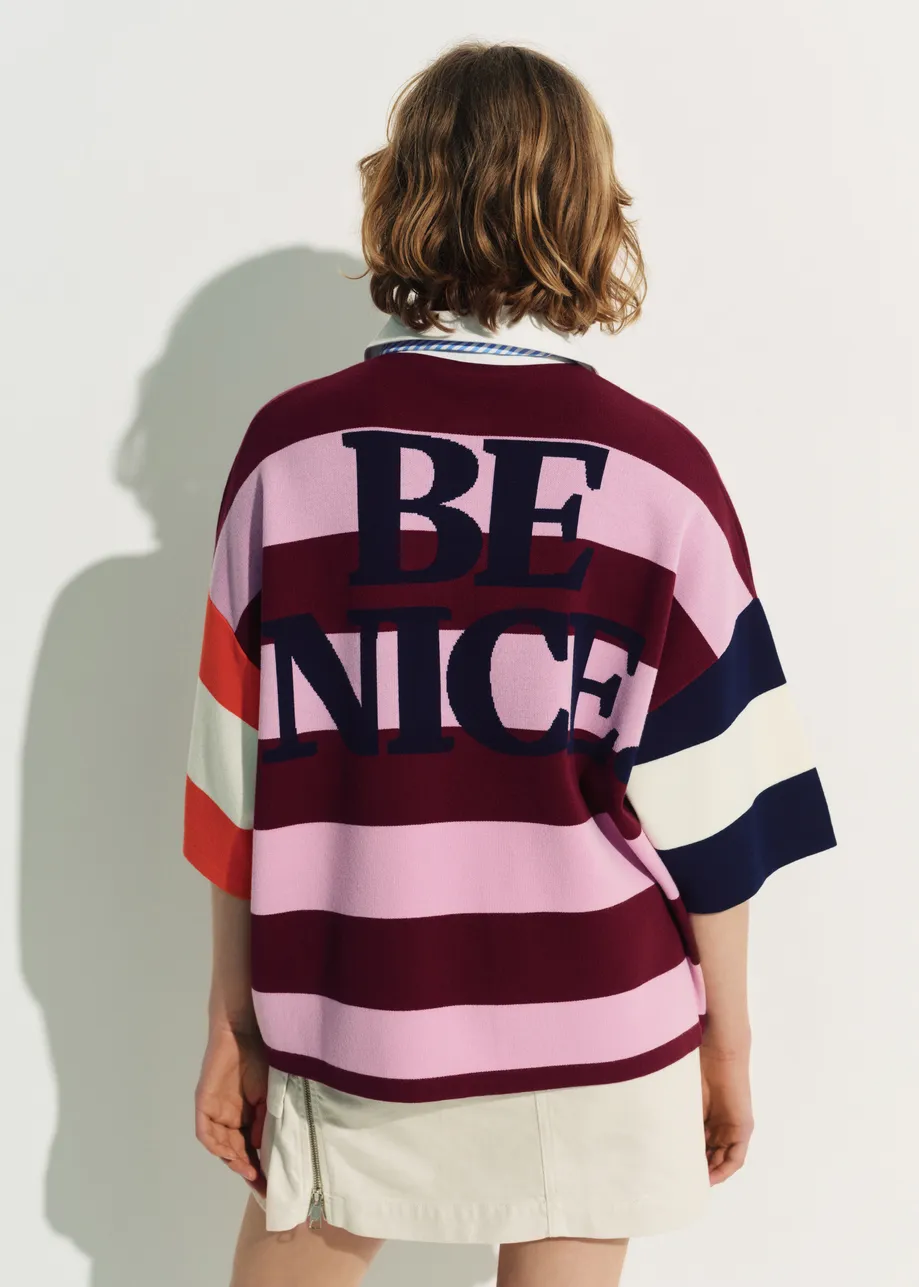 Pink and burgundy striped polo sweater with Peanuts™ patch and text
