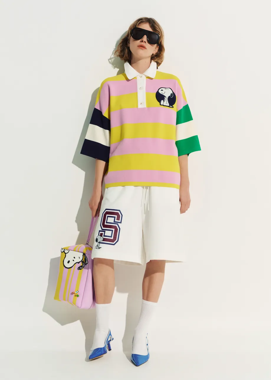 Lilac and yellow striped polo sweater with Peanuts™ patch and text