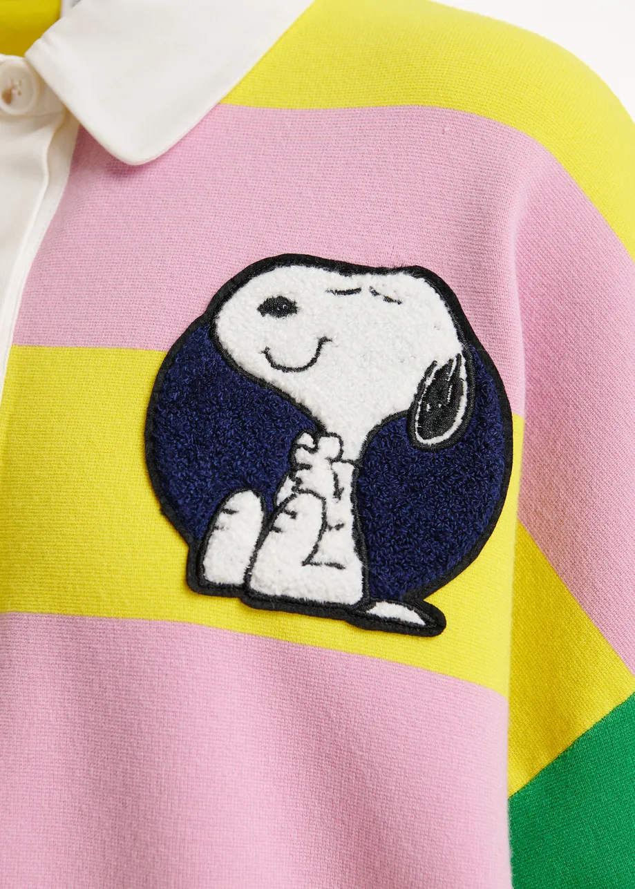 Lilac and yellow striped polo sweater with Peanuts™ patch and text