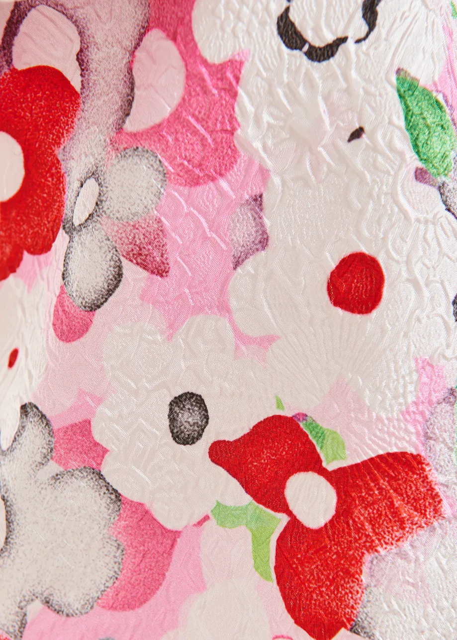 Gebroken witte en veelkleurige asymmetrische éénschoudertop met volants