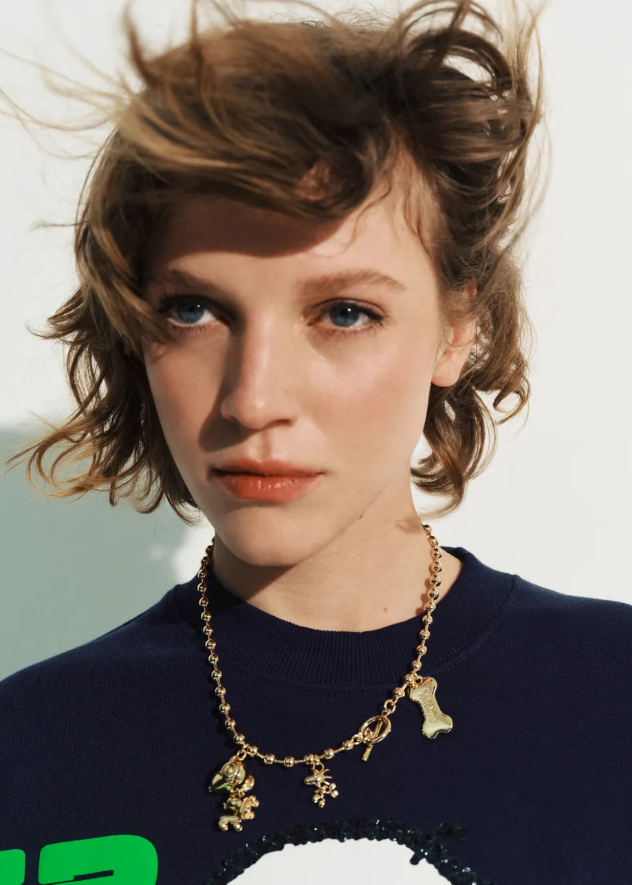 Gold-tone beaded Snoopy and Woodstock charm necklace