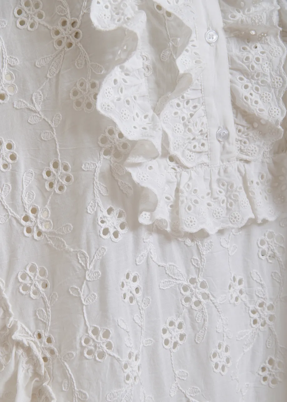 White broderie anglaise cotton mini dress with ruffled trims