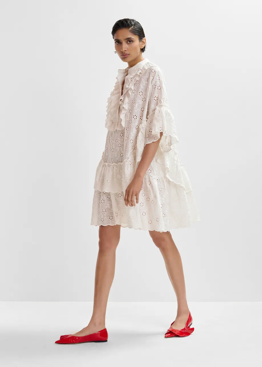White broderie anglaise cotton mini dress with ruffled trims