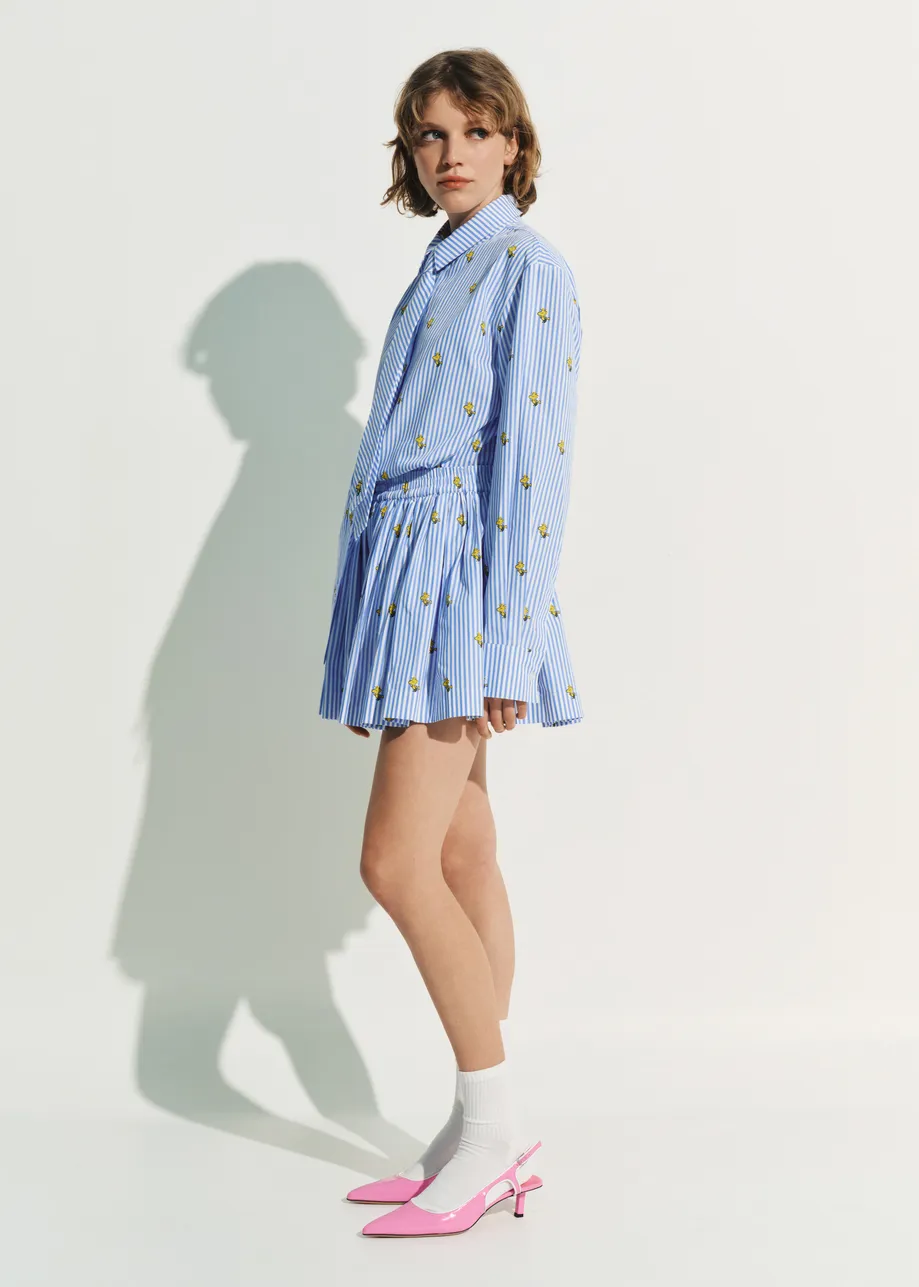 Light blue and white striped cotton shorts with yellow Peanuts™ print