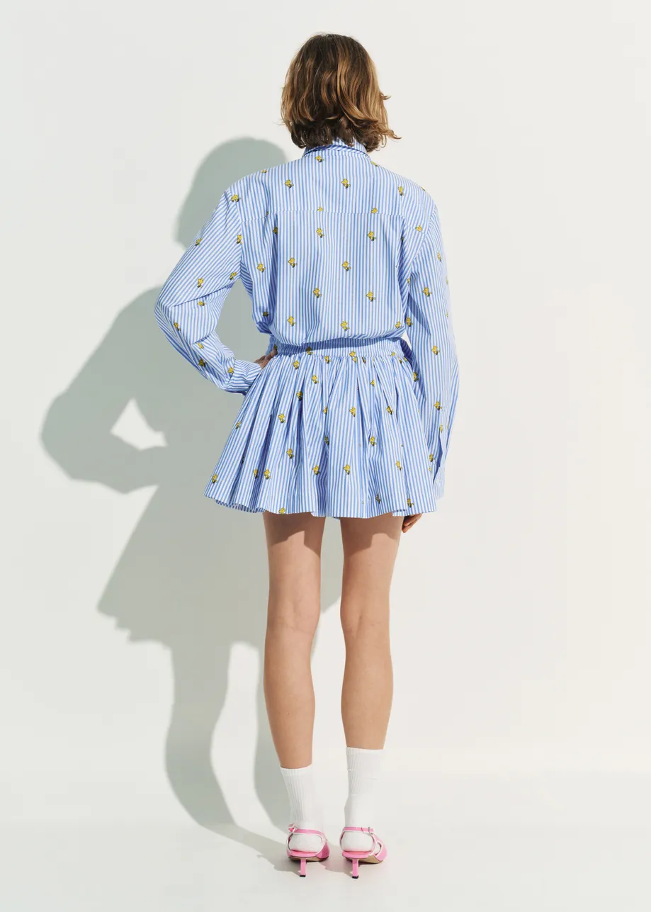 Light blue and white striped cotton shorts with yellow Peanuts™ print