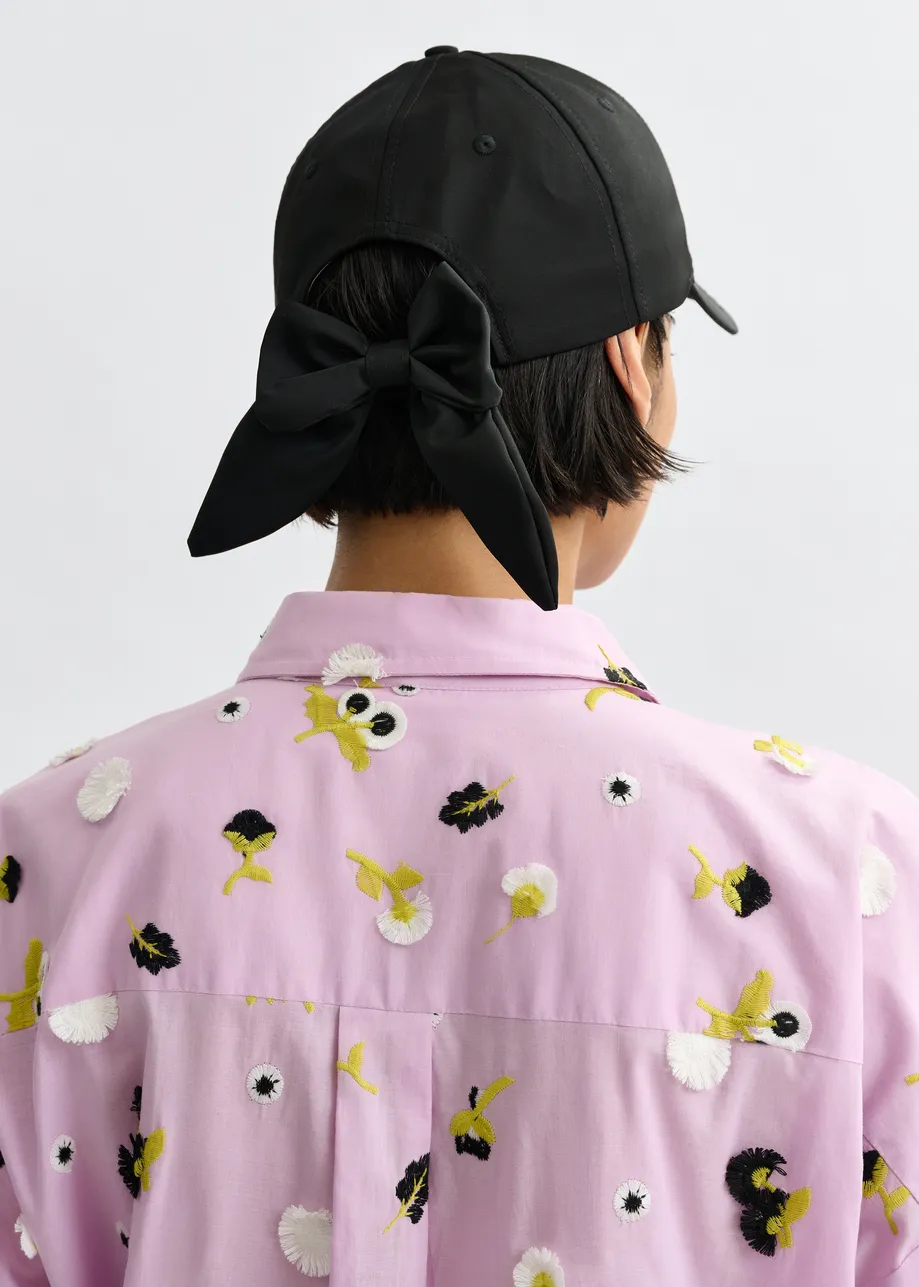 Black embroidered baseball cap with bow fastening