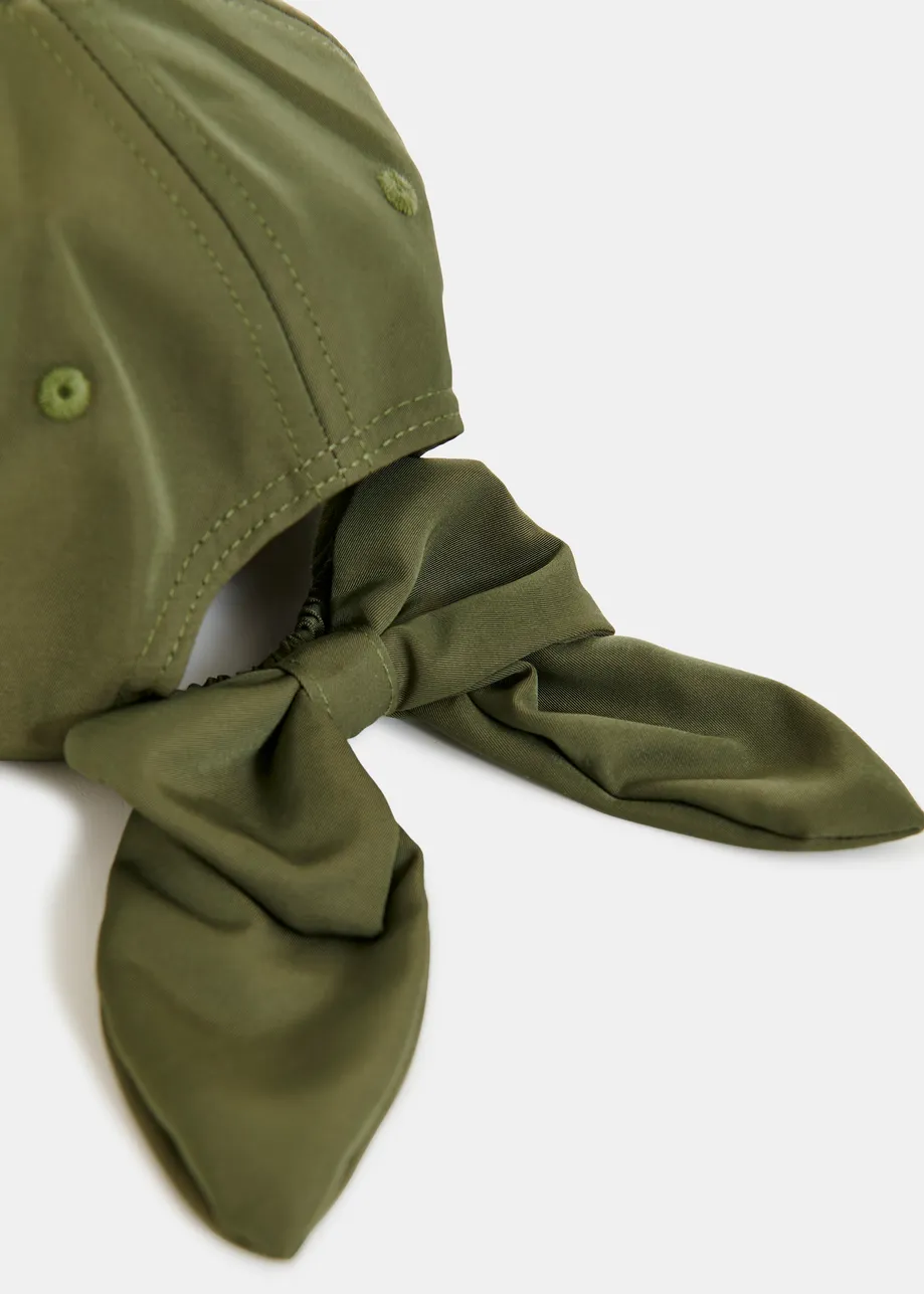 Khaki embroidered baseball cap with bow fastening