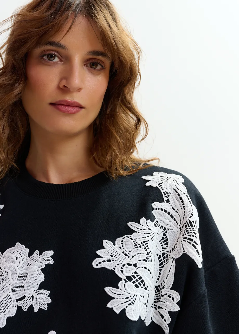 Black and white floral lace-embellished sweatshirt