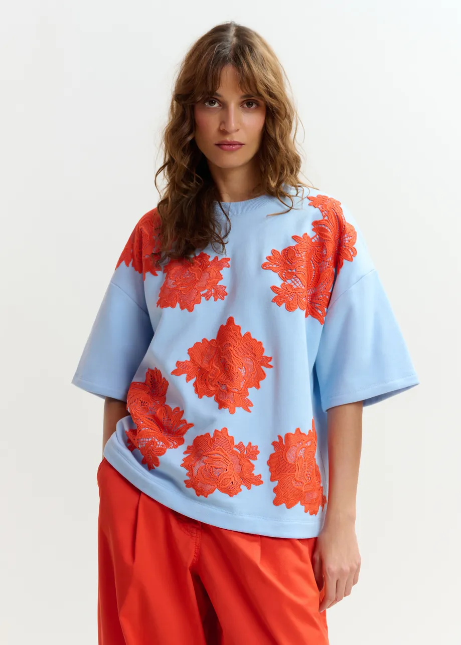 Light blue and orange floral lace-embellished sweatshirt