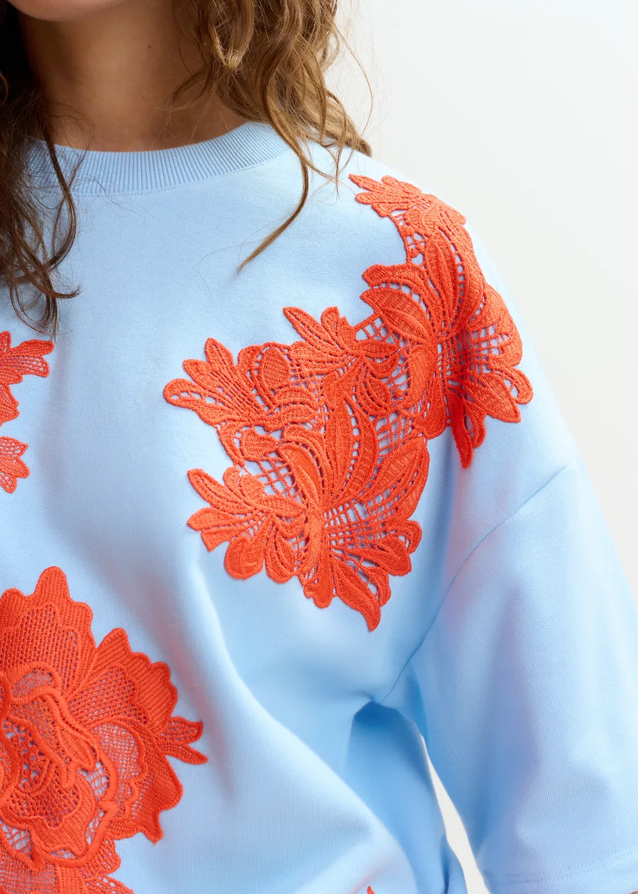 Light blue and orange floral lace-embellished sweatshirt