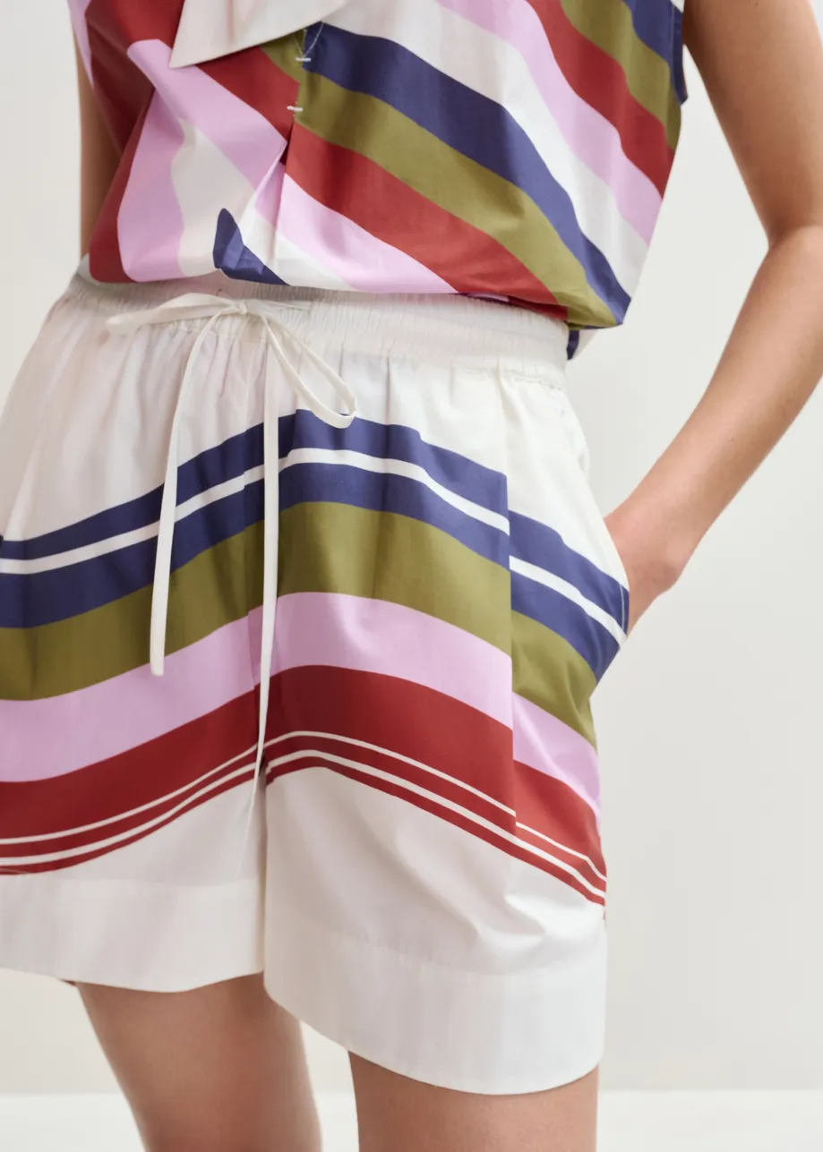 Pantaloncini in cotone bianco ottico e multicolor in stampa a righe piazzata