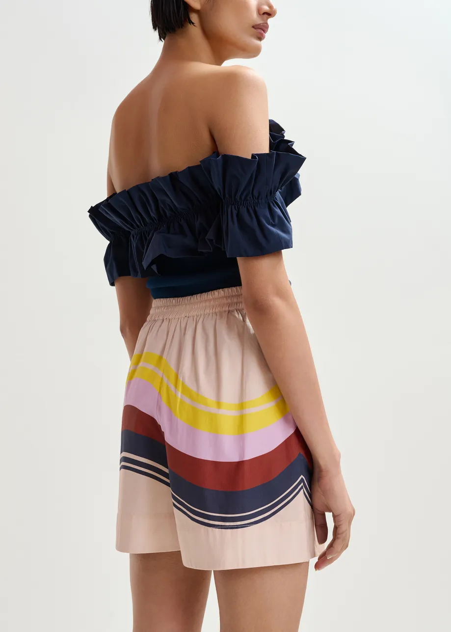 Pantaloncini in cotone color crema e multicolor con stampa a righe piazzata