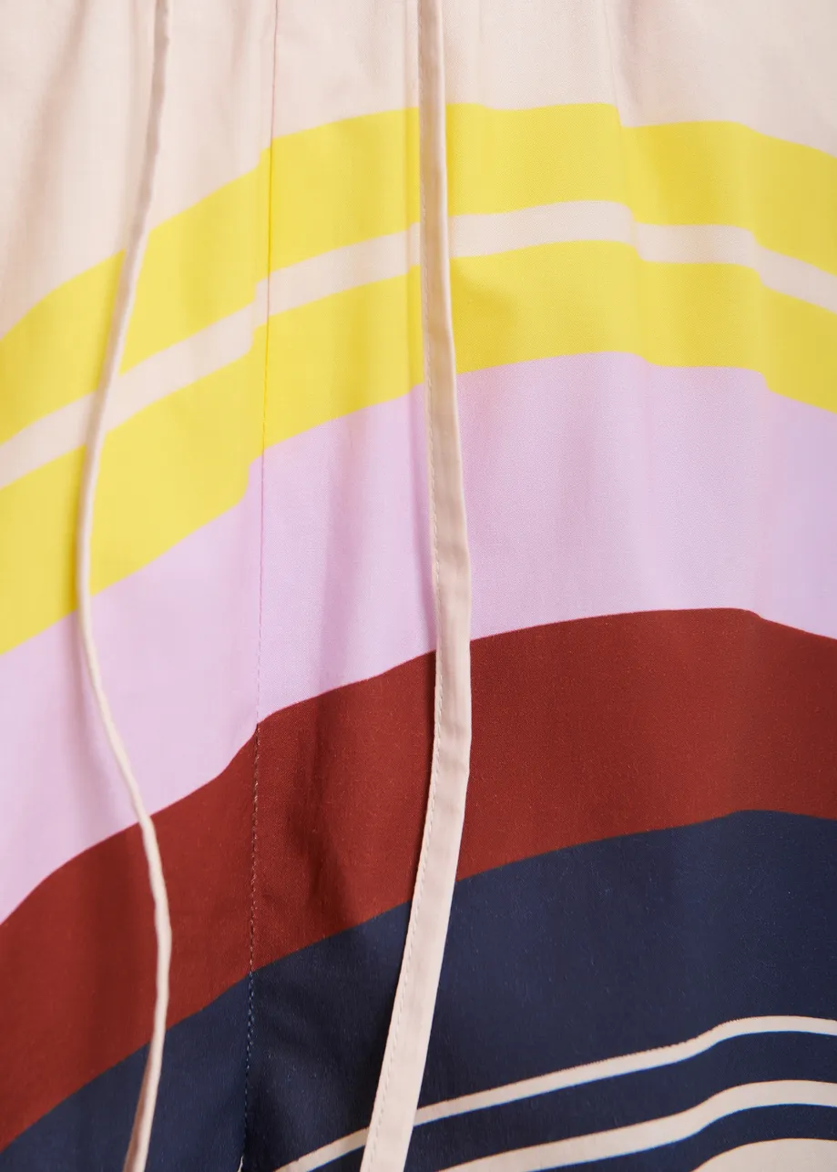 Pantaloncini in cotone color crema e multicolor con stampa a righe piazzata