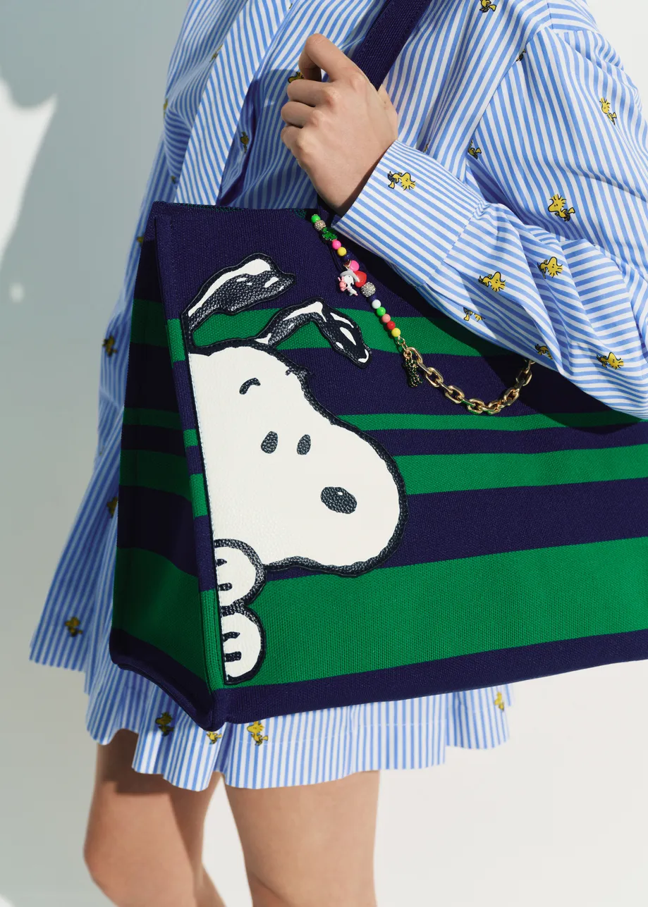 Navy and green striped shopper bag with Peanuts™ Snoopy graphics and lilac text print