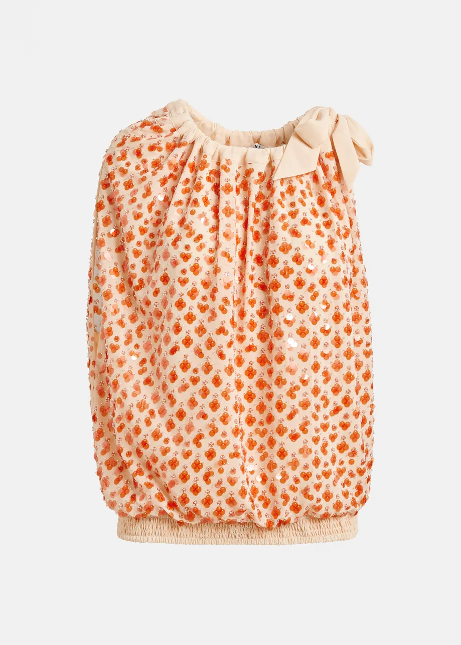 Oranje asymmetrische top met pailletten en strik