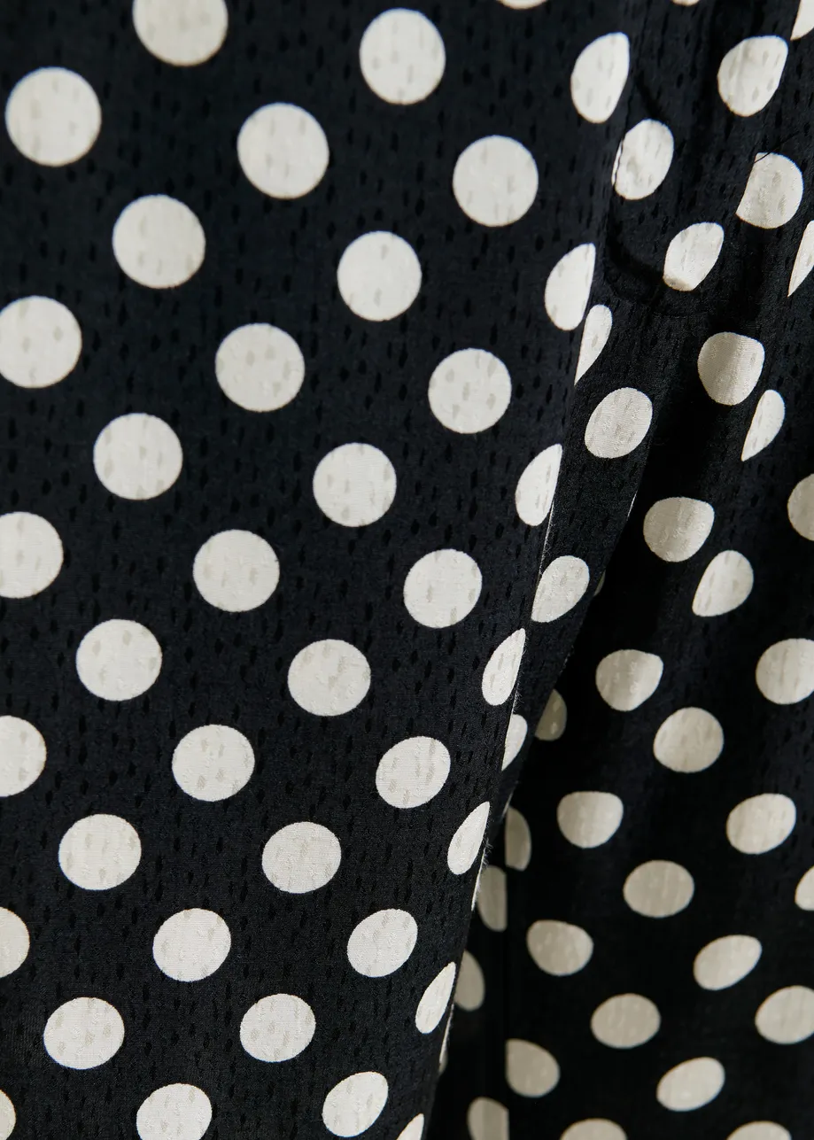 Zwart-witte broek met stippenprint 