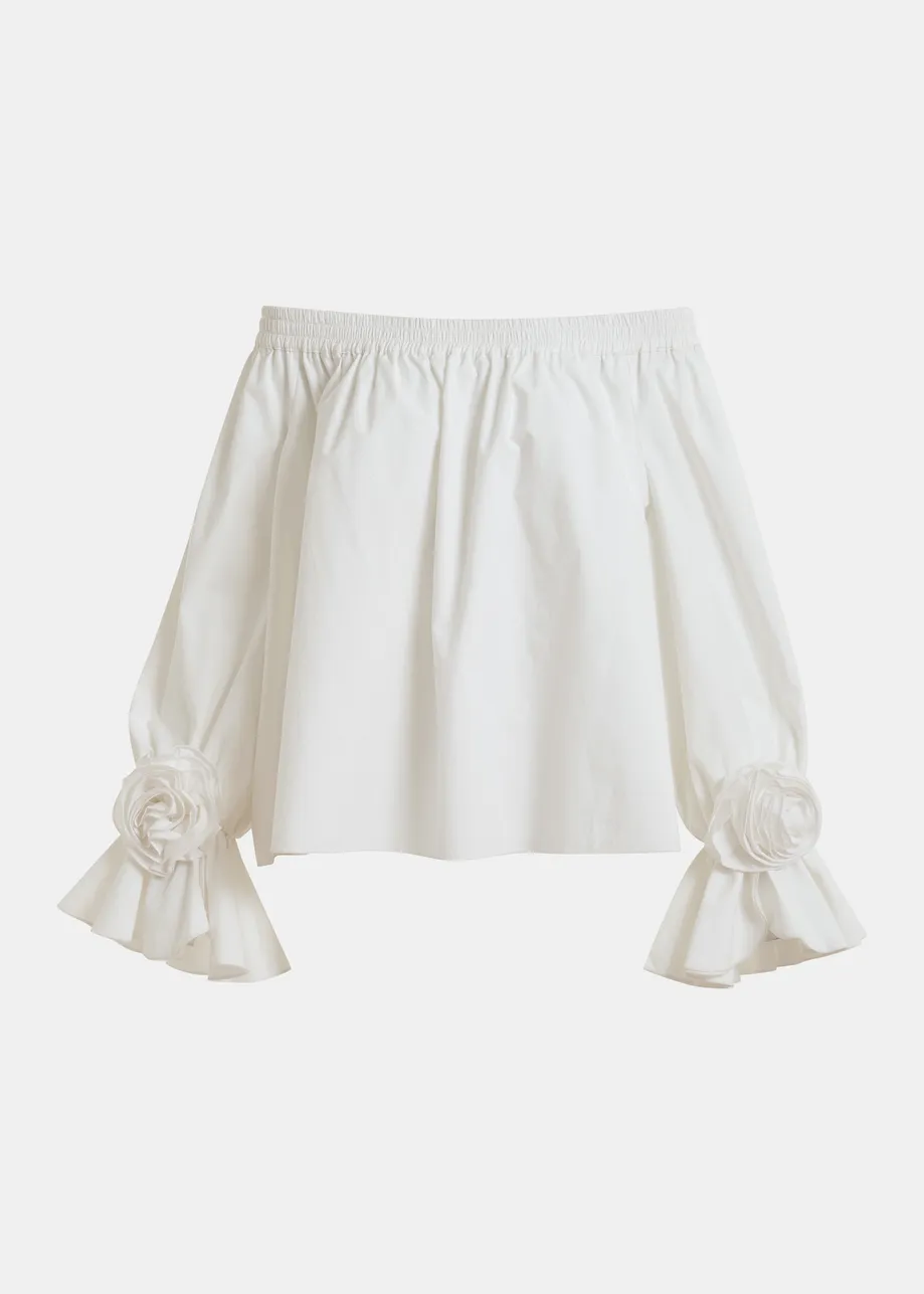 Gebroken witte strapless top met rozetdetails