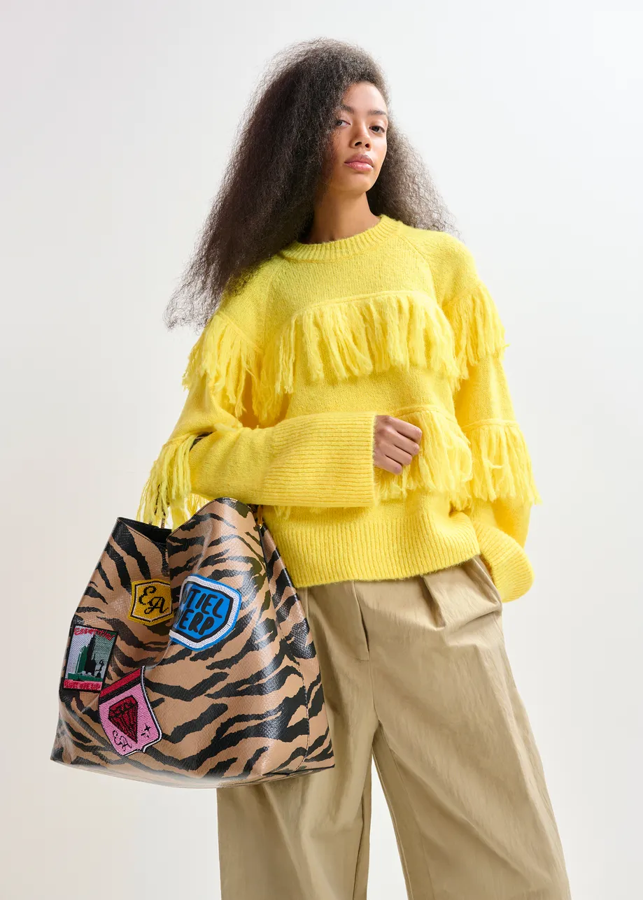 Yellow sweater with fringe details