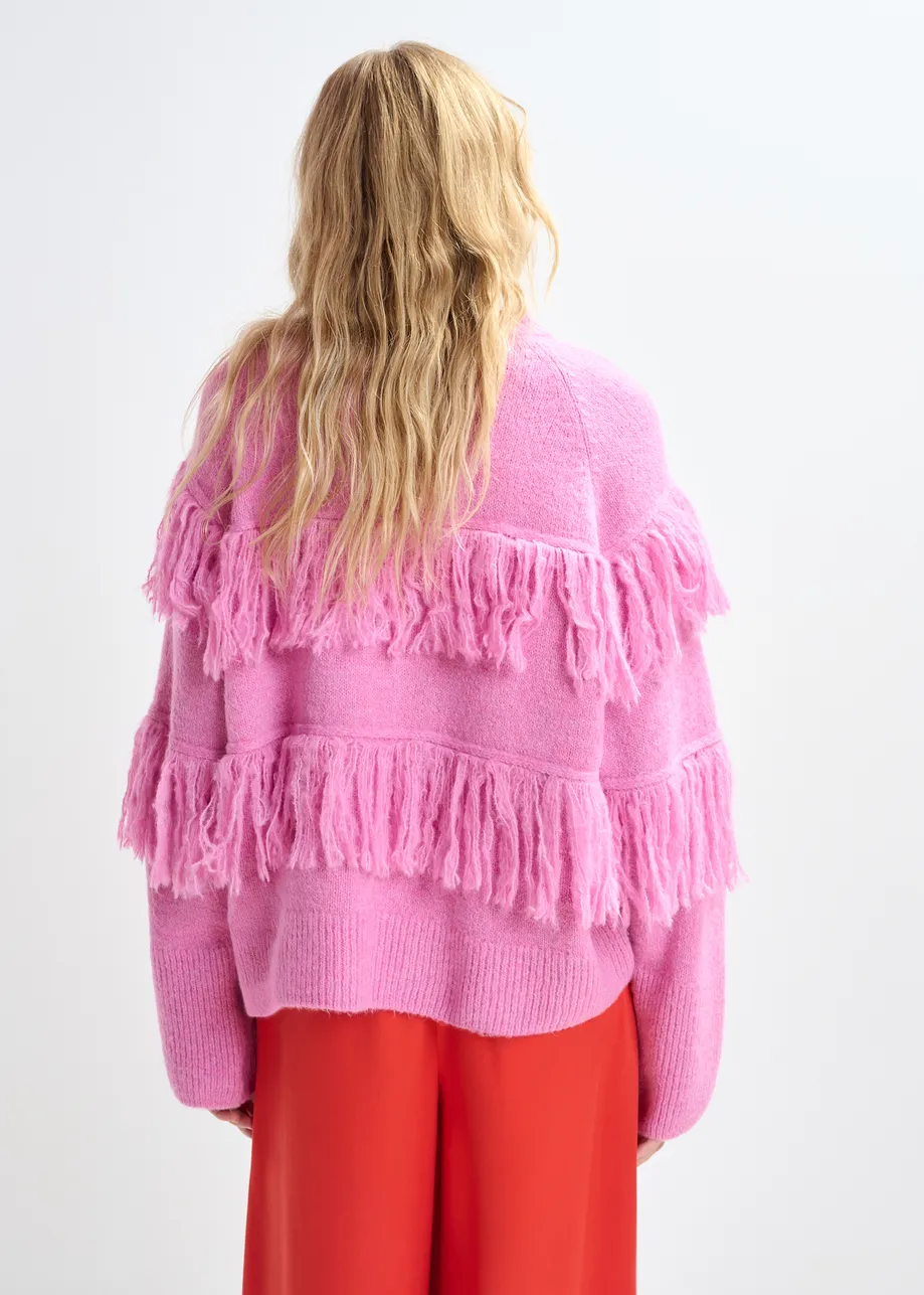 Pink sweater with fringe details