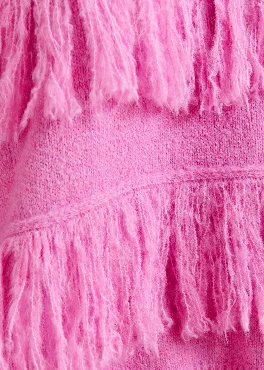 Pink sweater with fringe details