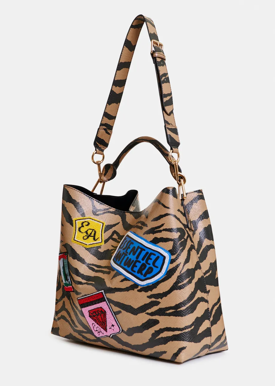 Brown and black tiger print glossy shopper bag with multicolor appliqued patches