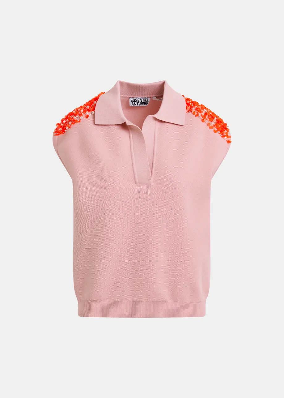 Light pink sleeveless polo with orange embellished shoulders