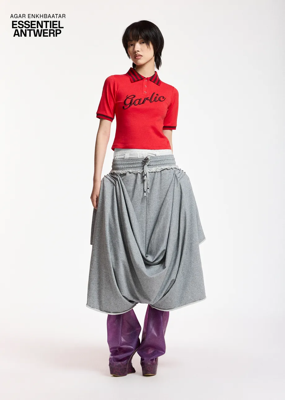 Light grey draped jersey pants with off-white lace undergarment
