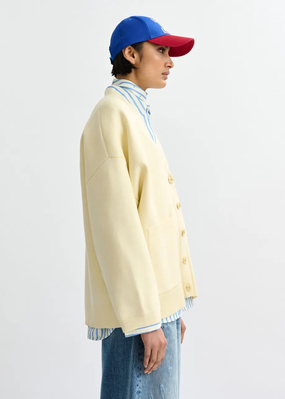 Gebroken witte cardigan met bloemknopen