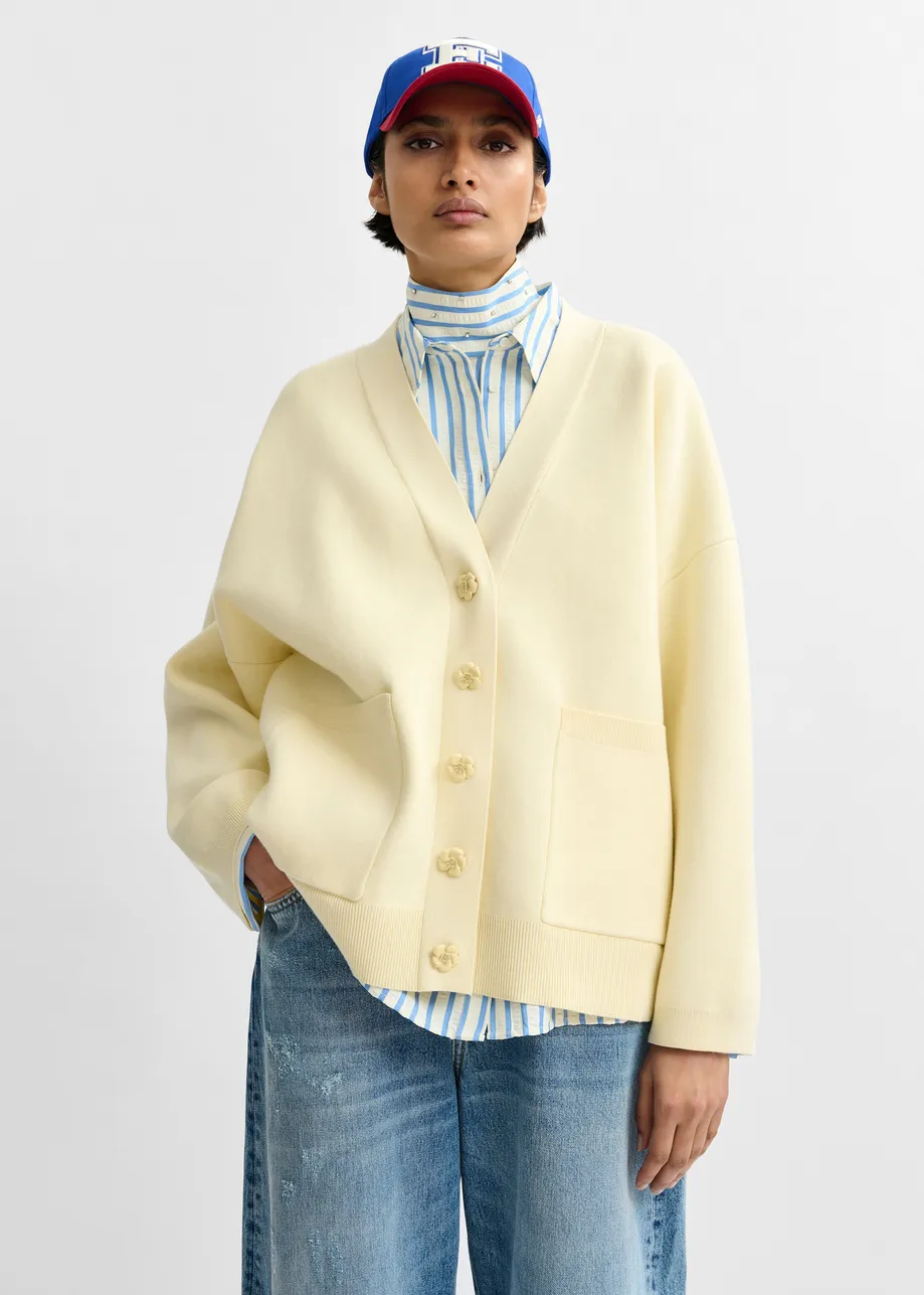 Off-white knit cardigan with tonal flower buttons