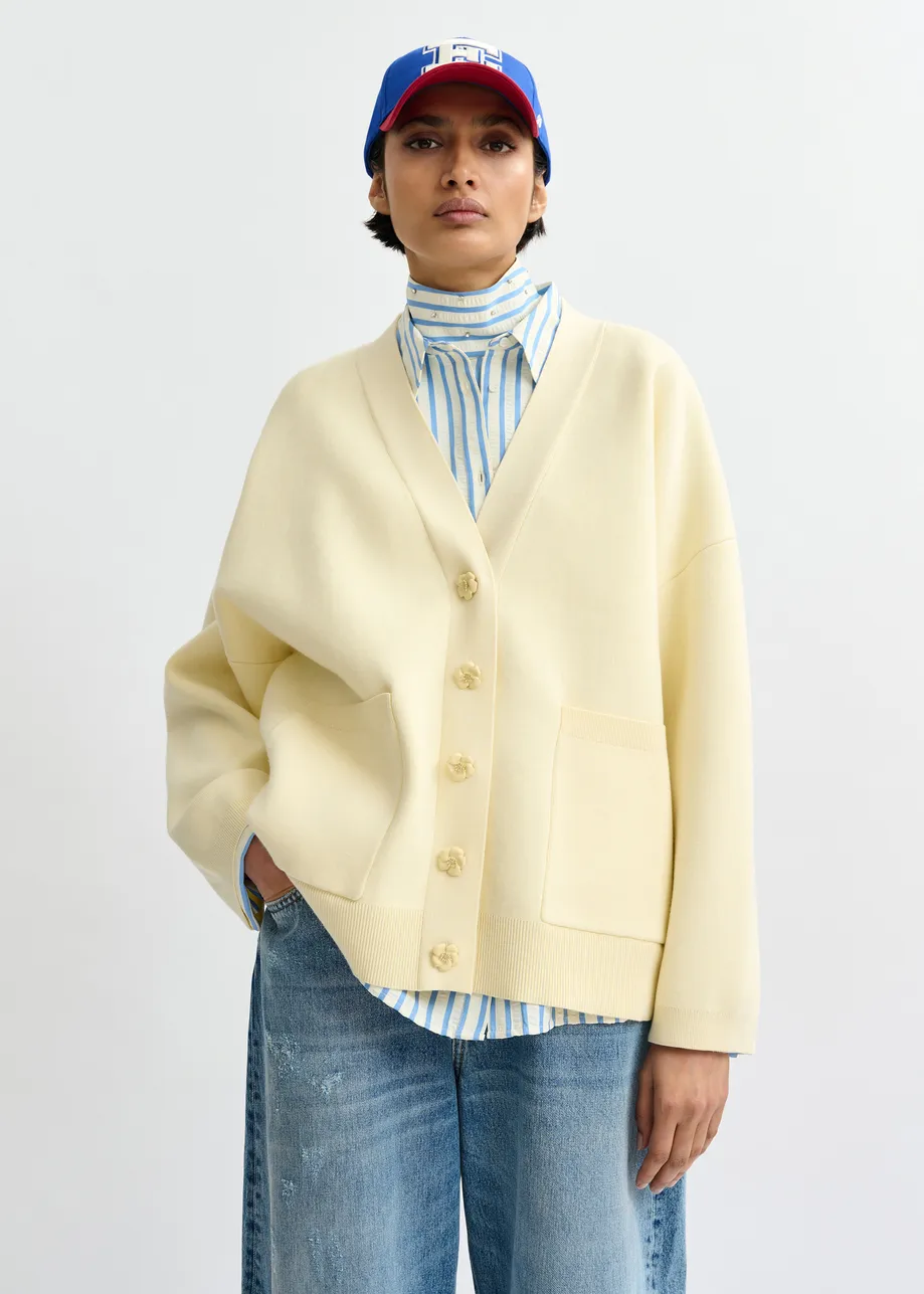 Off-white knit cardigan with tonal flower buttons