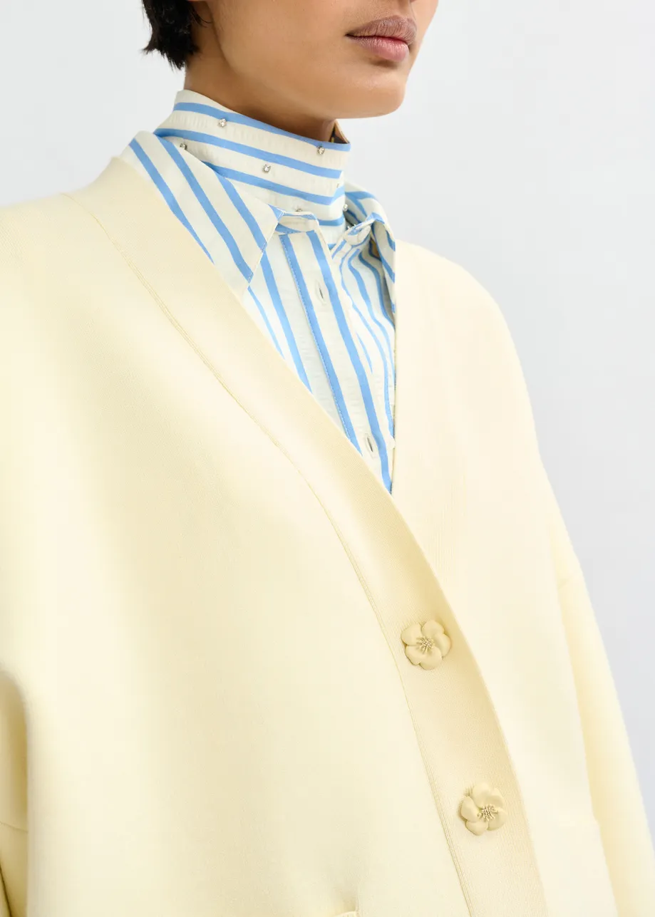 Off-white knit cardigan with tonal flower buttons