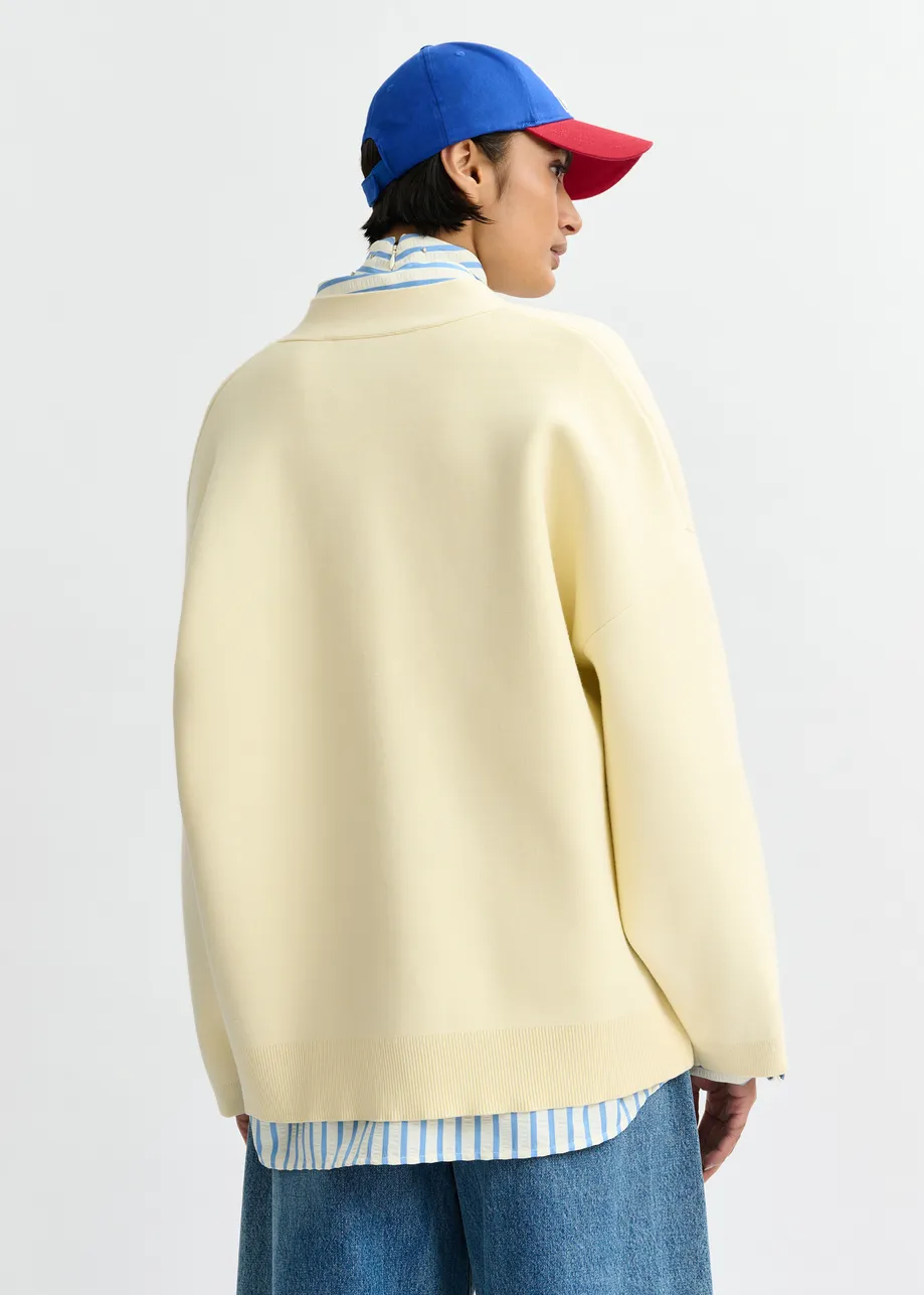 Off-white knit cardigan with tonal flower buttons