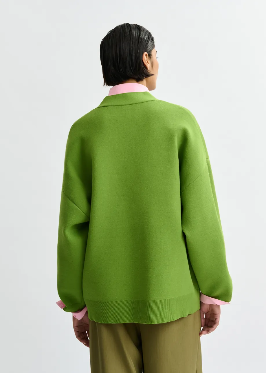 Groene cardigan met bloemknopen