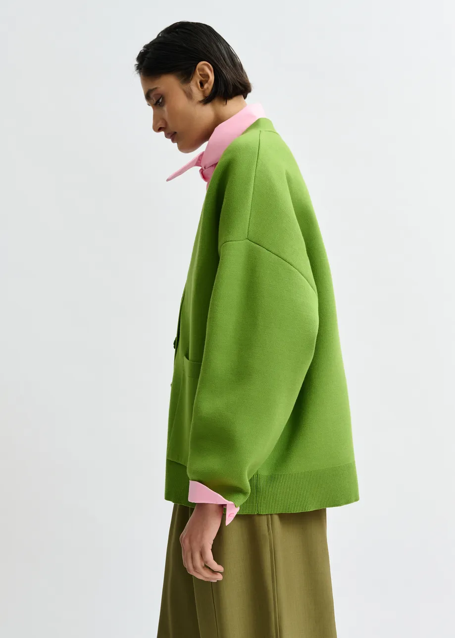 Groene cardigan met bloemknopen