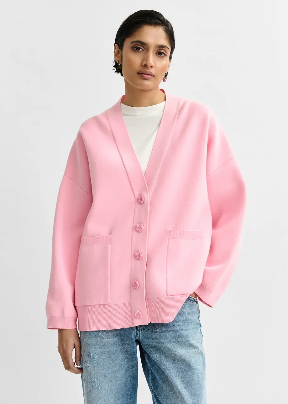 Pink knit cardigan with tonal flower buttons