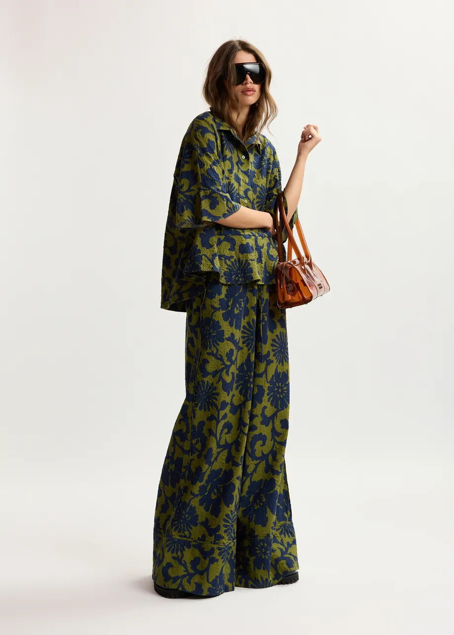 Green and dark blue wide-leg pants with contrast stitching