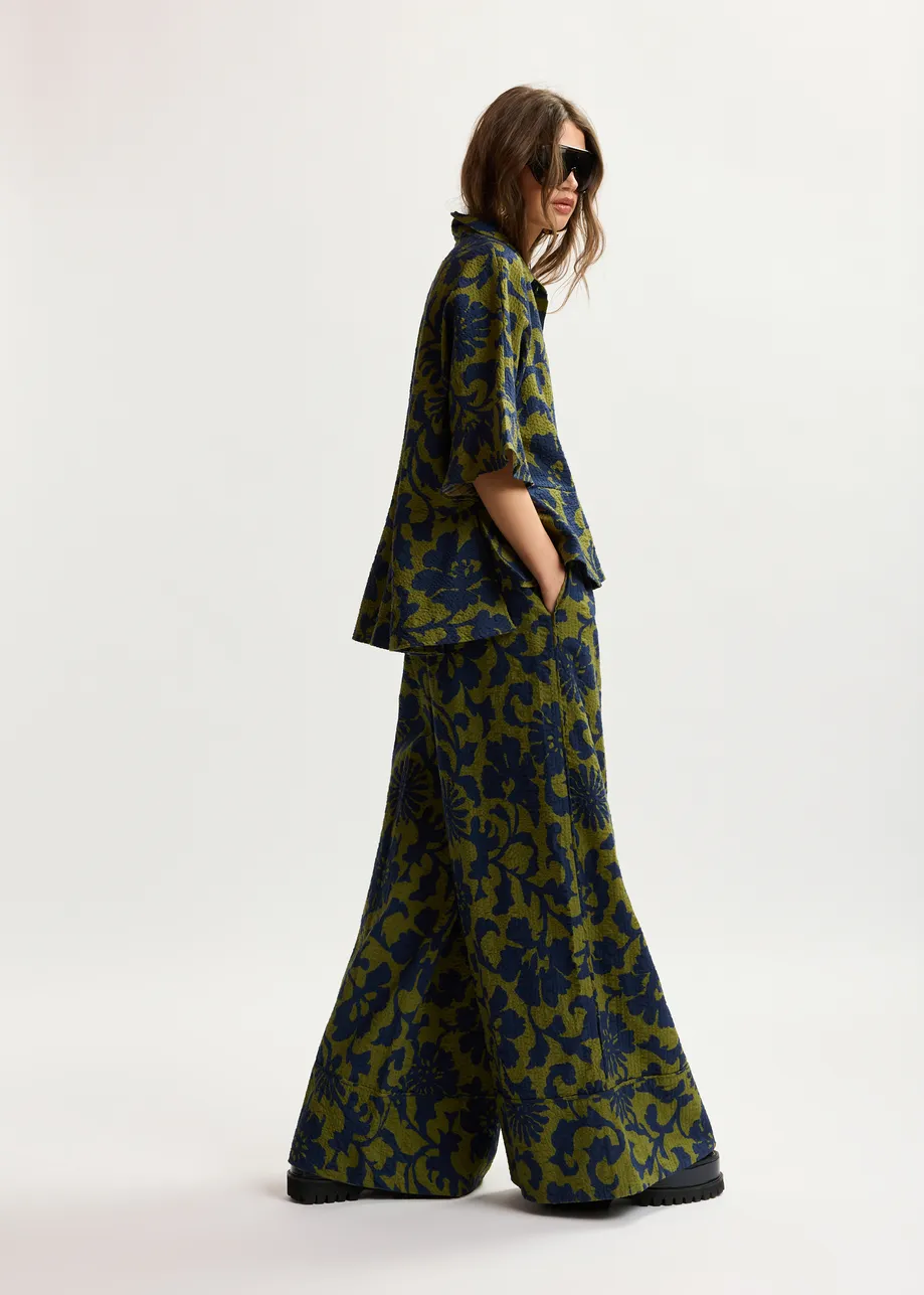 Green and dark blue wide-leg pants with contrast stitching