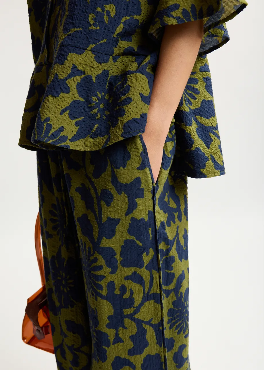 Green and dark blue wide-leg pants with contrast stitching