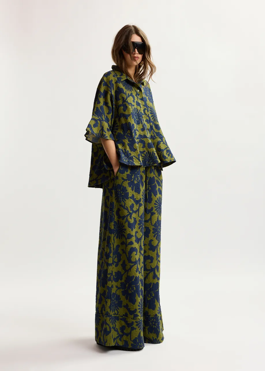 Green and dark blue wide-leg pants with contrast stitching