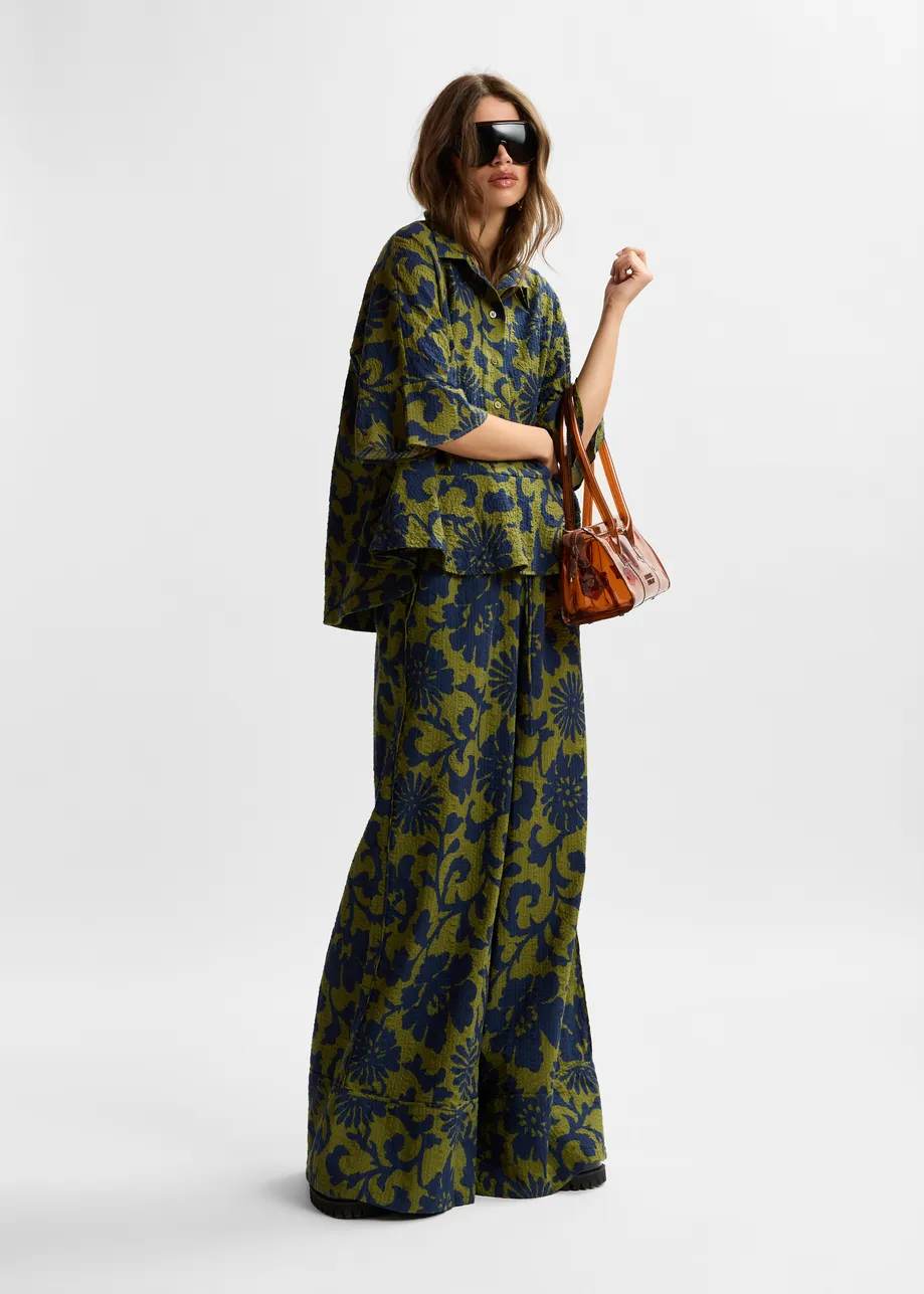 Green and dark blue wide-leg pants with contrast stitching